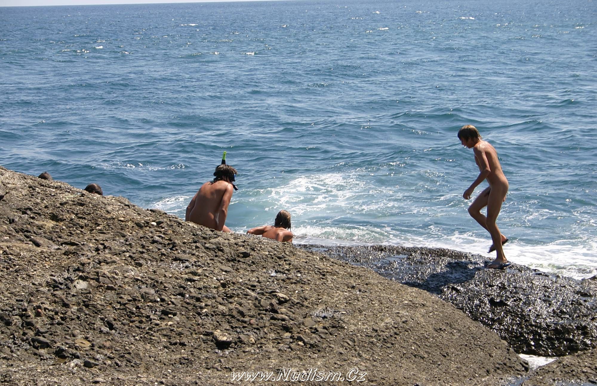 [Image: Leaning-Against-Hit-Rocks-Pure-Nudism-Photos-1.jpg]