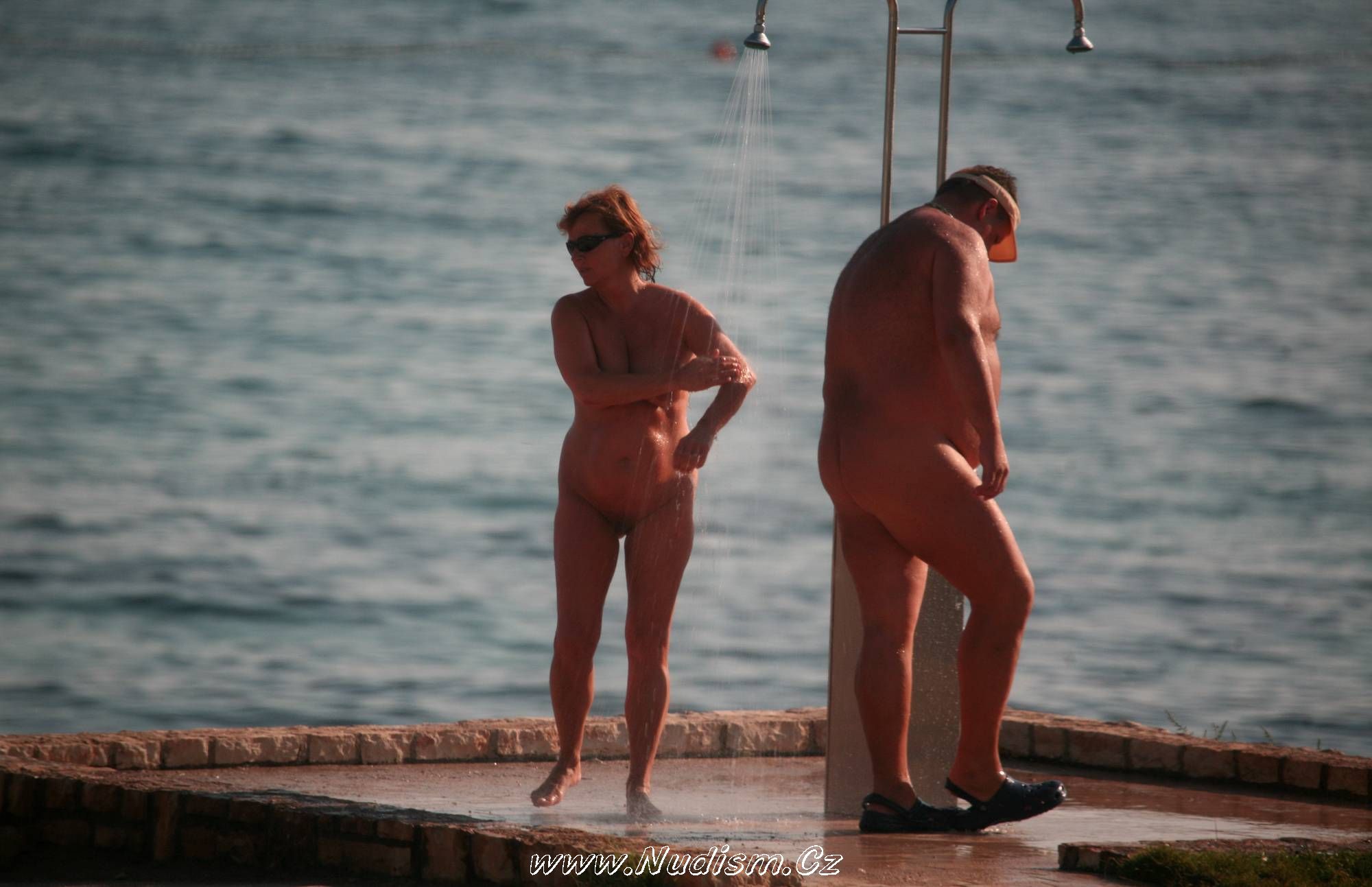 [Image: Naturist-Shower-at-Dusk-Purenudism-Images-3.jpg]