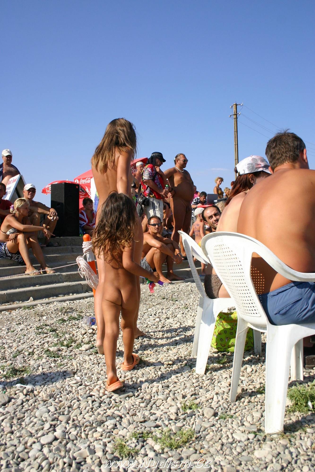 [Image: Naturist-Standing-Sideline-Pure-Nudism-Photos-2.jpg]